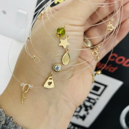 14k gold pendant with clear string