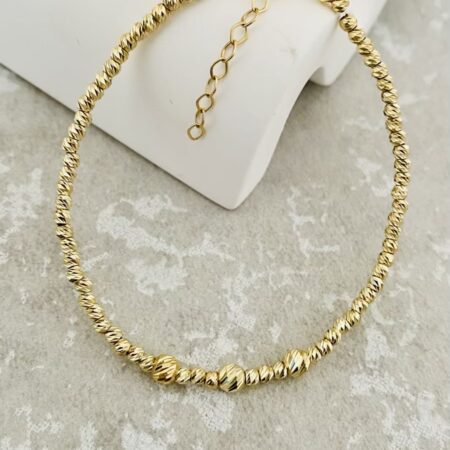 14k gold 2.5mm beads with middle 4mm on a clear string 17cm+2cm bracelet