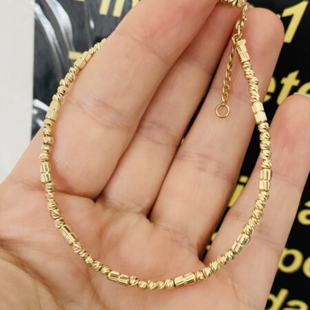 14k gold 2.5mm beads 4.5mm on a clear string 20cm +2cm bracelet