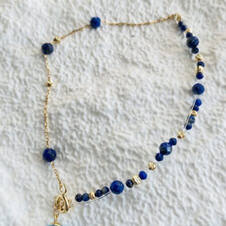 Unique bracelet with 14k gold beads and lapis lazuli beads with light blue stone 17.5cm